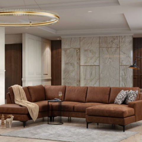 Brown sectional sofa in a modern living room with marble walls and decorative lighting.