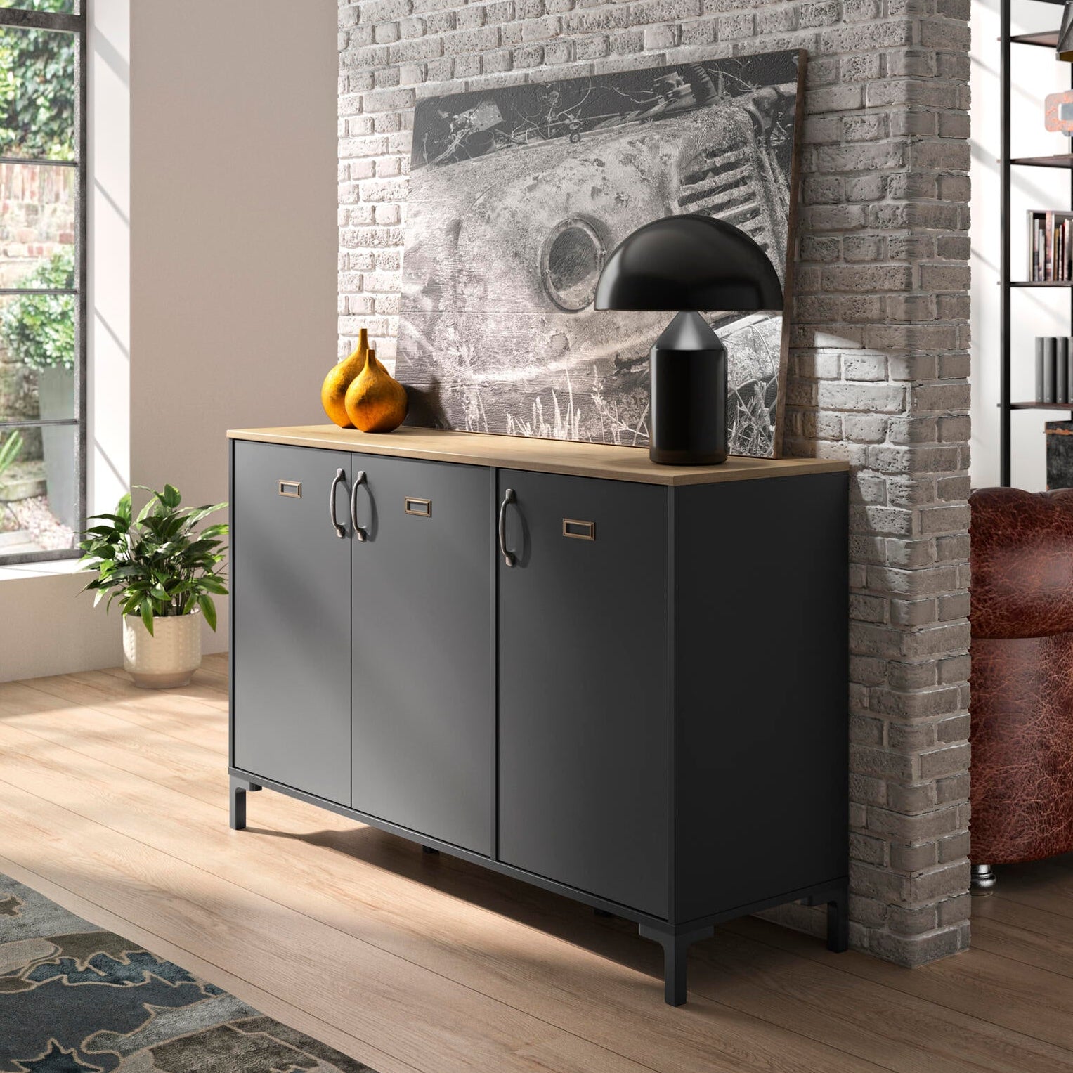 Modern interior with a gray sideboard, brick wall, and decorative items.