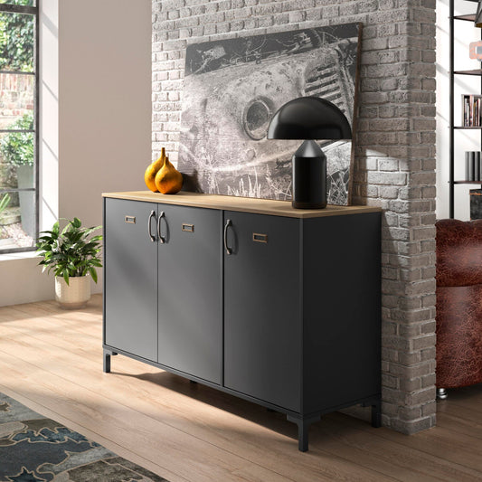 Modern interior with a gray sideboard, brick wall, and decorative items.